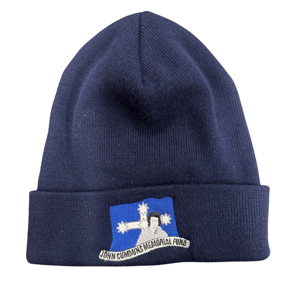 Navy knit beanie with a blue patch reading 'John Cummings Memorial Fund' on the front.