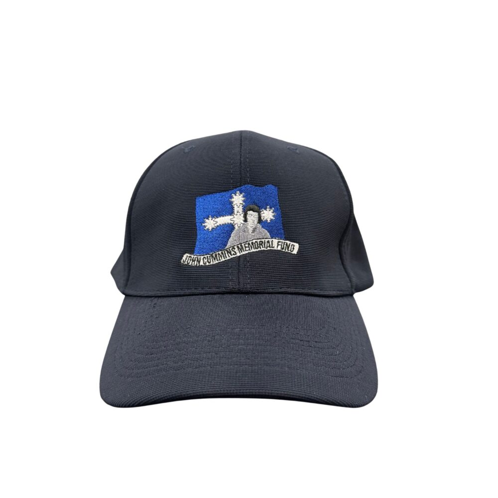 Navy baseball cap with an embroidered patch reading 'John Cummins Memorial Fund' on a blue background.